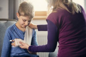 child with arm in a sling