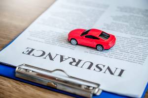 car insurance form with toy car