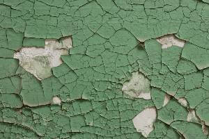 peeling green paint on wall