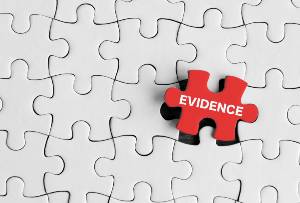 red puzzle piece on a puzzle