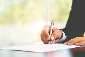 signing a document during daytime