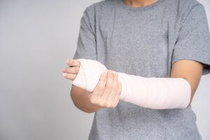 man's arm wrapped up in a cast