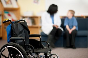 empty wheelchair in room with cp patient