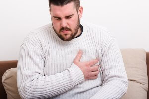 man with pain in his chest