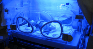 newborn in NICU/incubator