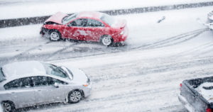 Multi-vehicle pileup on a snowy Baltimore highway involving several cars and icy road conditions.