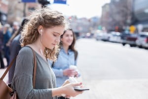 woman looking at a cell phone